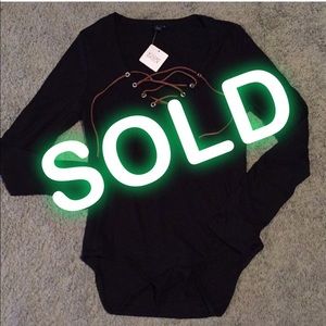 UK2LA bodysuit. Black with faux suede tie on chest